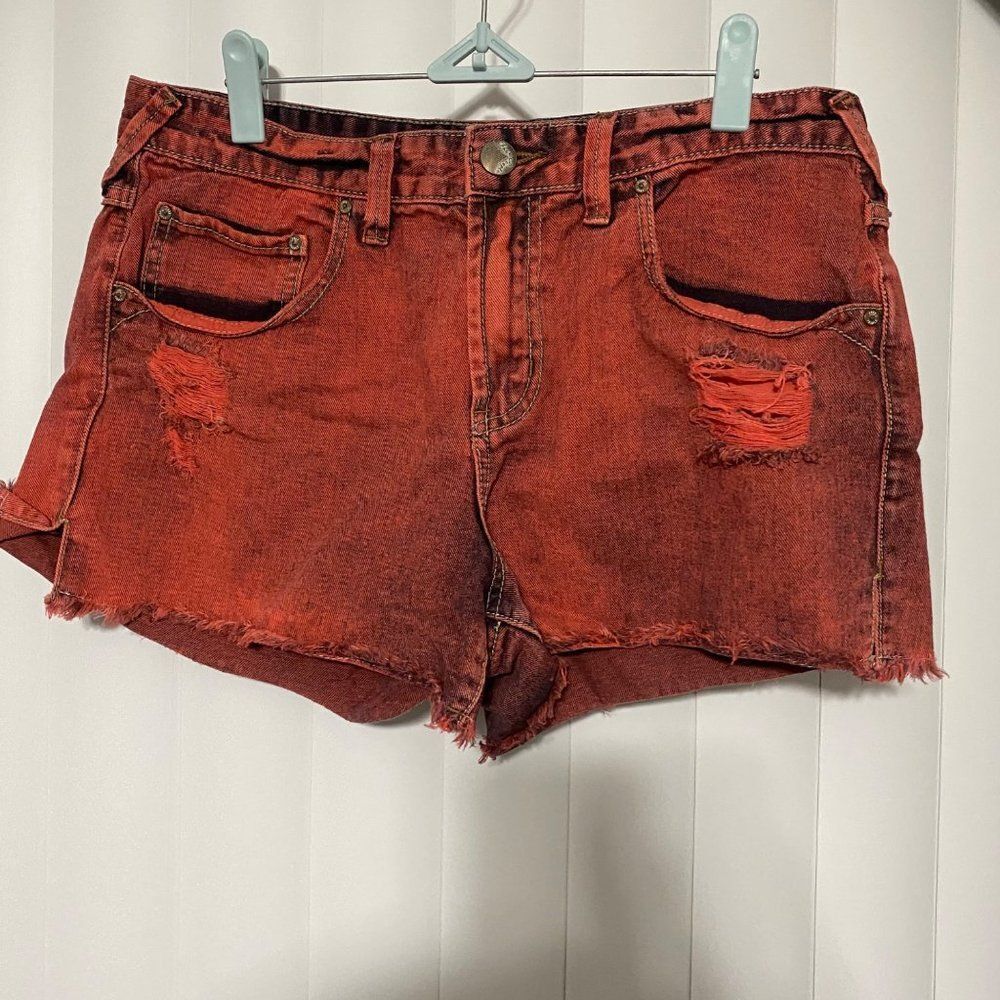Free People distressed red denim shorts
